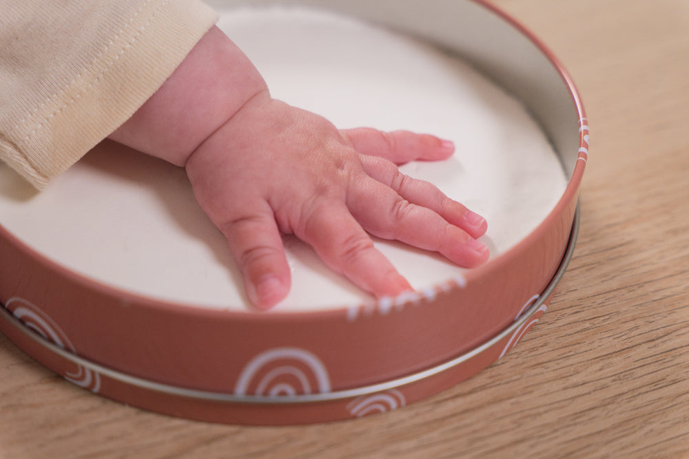 Create lasting hand or footprints with hypoallergenic clay and the included tools.
