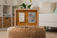 Classic Frame Daisy Ochre allows you to showcase a cherished photo alongside your baby’s hand or footprint.