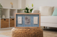 Designed to hold two baby imprints and a cherished photo, the 2 Prints Frame Blue Abstract  is ideal for celebrating the growth of your child or capturing memories of twins.