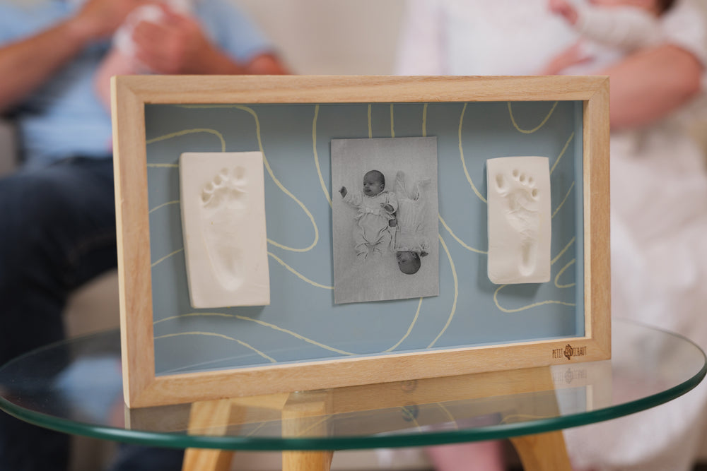 Display two adorable baby hand or footprints alongside a favorite photo with  2 Prints Frame Blue Abstract