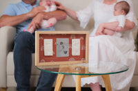 Designed to showcase two baby imprints and a photo, this elegant frame is perfect for twins, capturing baby growth milestones, or creating a cherished baby keepsake for your home.