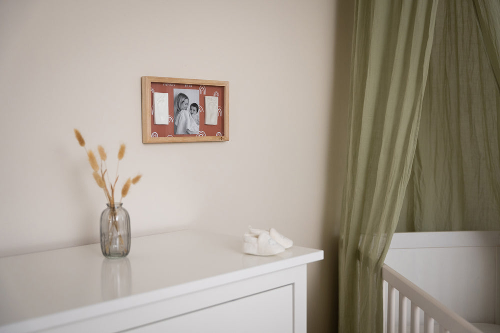 2 Prints Frame Rainbow Terracotta is a stylish frame with a reversible terracotta and rainbow background adds a warm, modern touch to any nursery or family space.