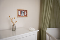 2 Prints Frame Rainbow Terracotta is a stylish frame with a reversible terracotta and rainbow background adds a warm, modern touch to any nursery or family space.